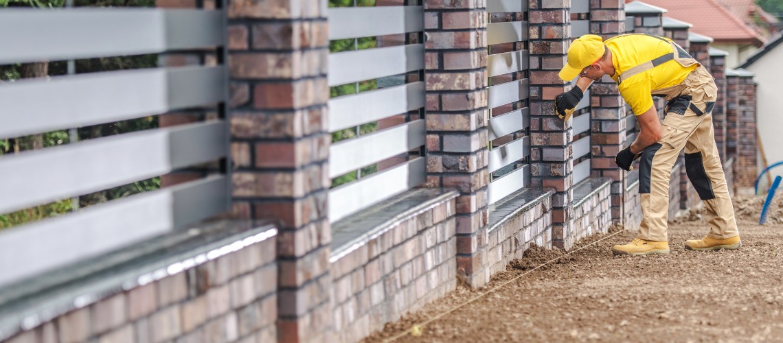 A construction worker in a yellow shirt