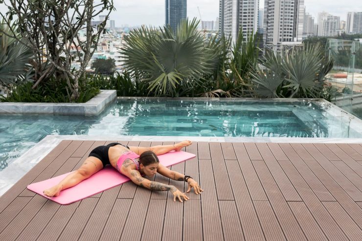 woman-doing-yoga-outdoors-by-pool-with-copy-space_23-2148732871 woman-doing-yoga-outdoors-by-pool-with-copy-space_23-2148732871